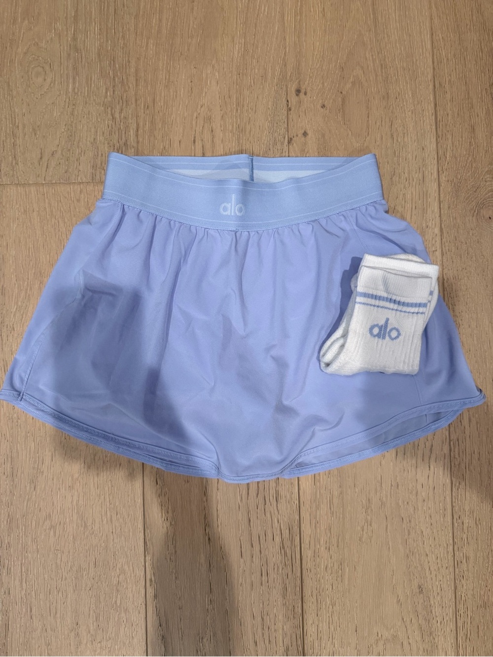 ALO Yoga Lavender Match Point Skirt with matching ALO socks.
